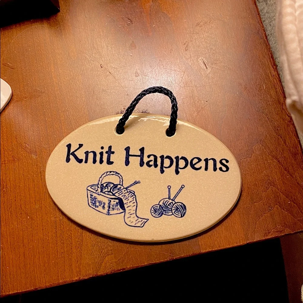 “Knit Happens” Hanging Plaque by Mountain Meadows Pottery. Features Yarn/Needles